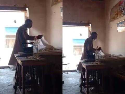Elderly-man-Iron-Clothes Man-Spits-on-Clothes-to-Iron Viral-Video